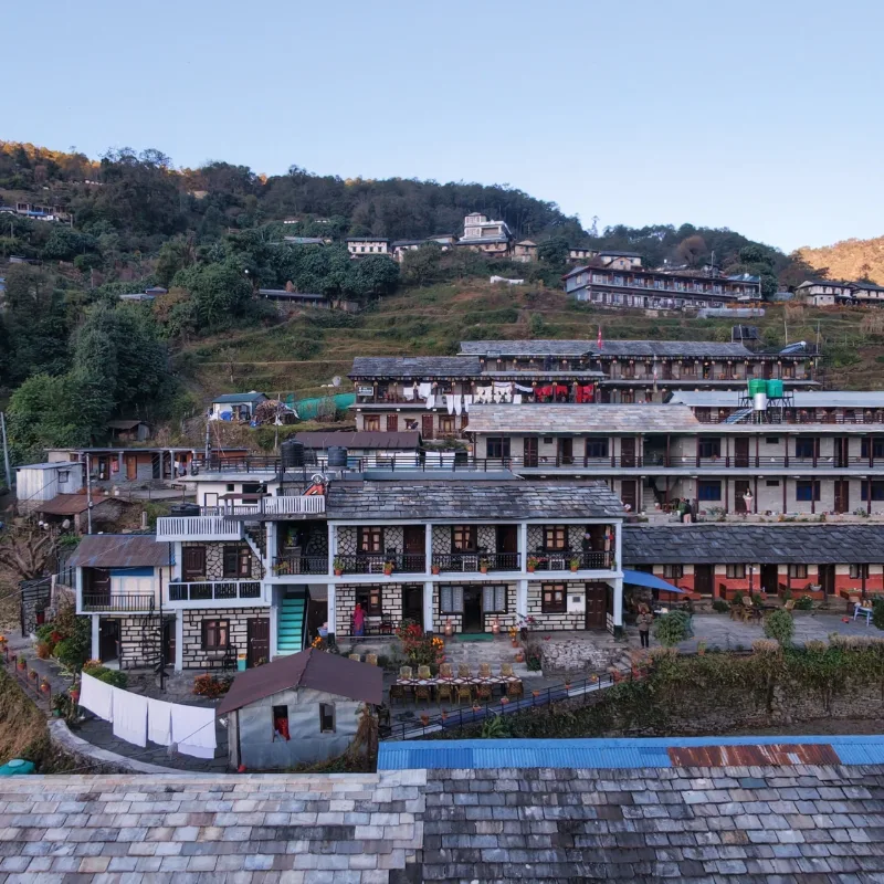 Aerial view of traditional stone-roofed Gurung houses clustered in Ghandruk village during Ghorepani Poon Hill Trekking Nepal.